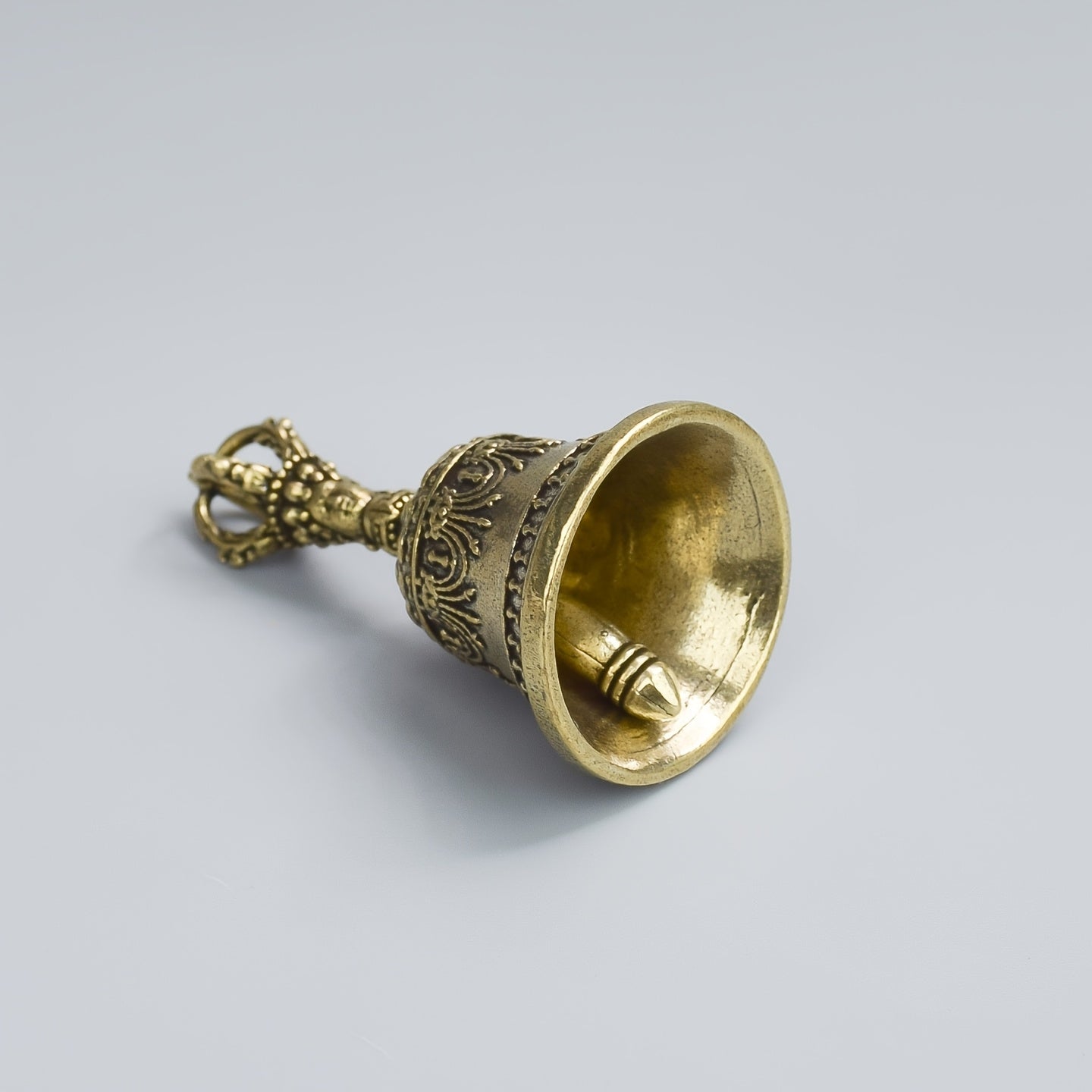 one carved bronze bell hand held shaker clapping handle