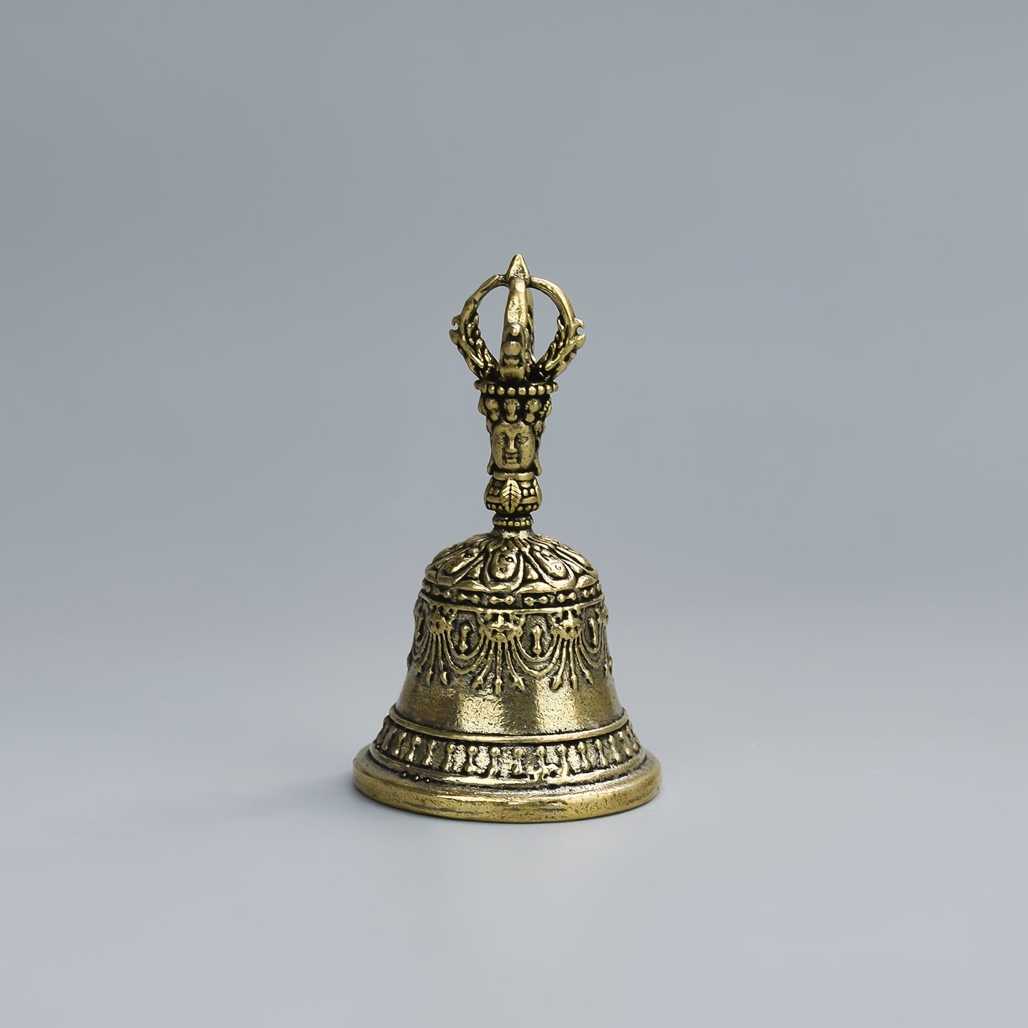 one carved bronze bell hand held shaker clapping handle